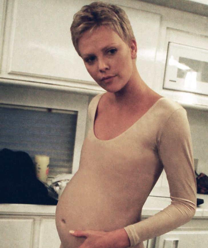 Charlize Theron trying on her silicone belly for The Astronaut’s Wife