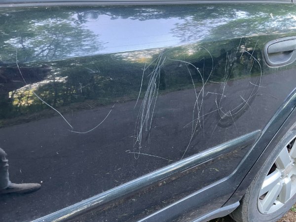 “Neighbor’s kid decided to decorate my car with a rock to make it look “cute.”