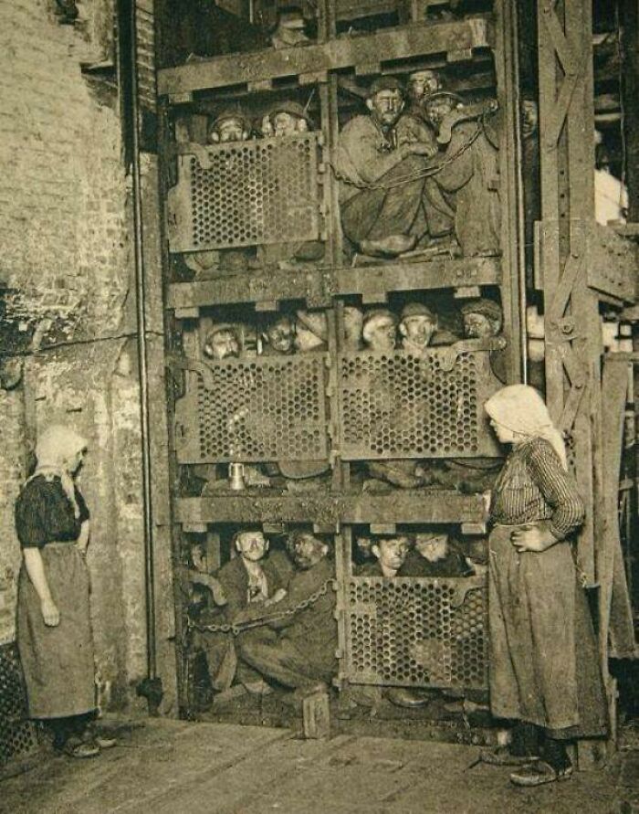 Coal Miners Coming Up A Coal Mine Elevator After A Day Of Work In 1920's Belgium