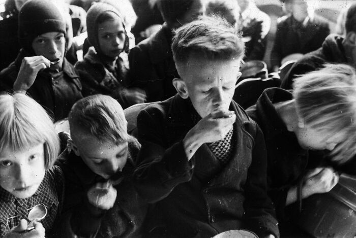 Children Eating The Half A Liter Of Supplementary Food Per Day Received From The Interkerkelijk Bureau Voor Noodvoedselvoorziening En Kinderuitzending During The Hunger Winter, The Hague, Netherlands, 1944/45, Photo By Menno Huizinga