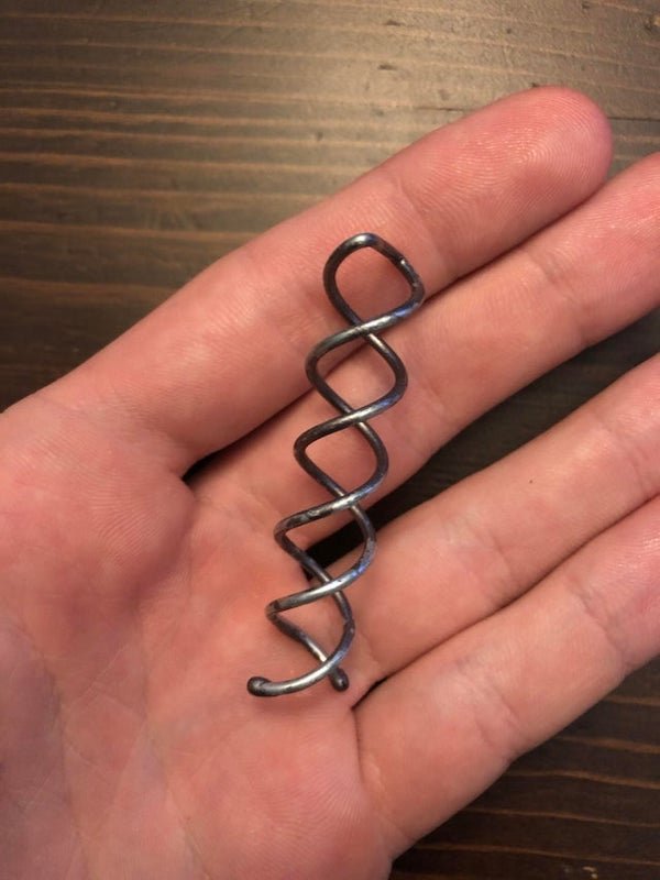 It’s a weird little double helix thing made of a light metal, found on Georgia Tech campus. Makes for a nice necklace ornament, but what is it?A: Spiral hair pin. Used to secure a bun.