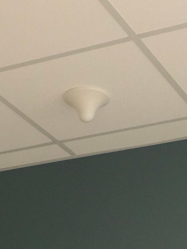 This object is hanging from the ceiling of our waiting room at the hospital. It’s a white smooth dome with no numbers or labels of any kind. Anyone know what this is for? My thought was wifi or a signal booster.A: Signal booster
