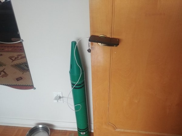 How my sister charges her phone, by leaving it precariously balanced on a DOORKNOB.