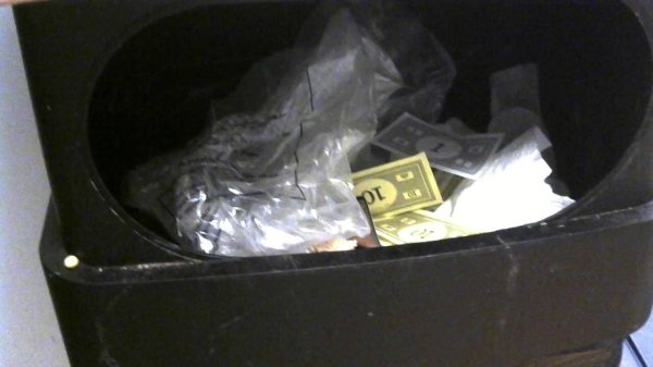 my little brother was too lazy to clean up monopoly so he threw it in the trash