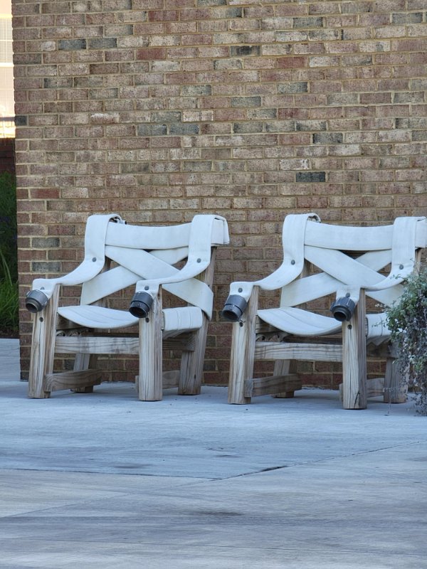 “These chairs made from old fire hoses, in front of a fire station.”