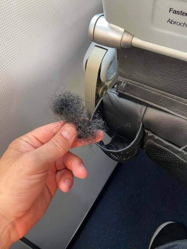 “We sterilize every flight” but apparently do not remove human hair from a cup holder do we JetBlue?