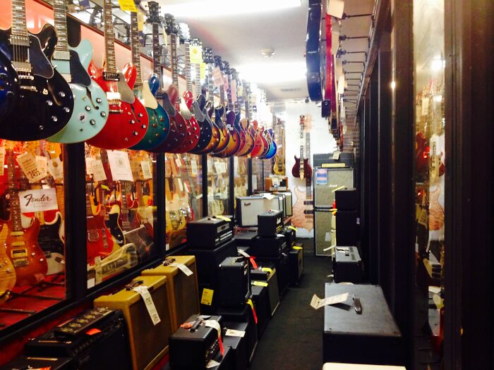 Working in a music store ( musical instruments )

Your days are spent listening to 50 different people play 50 different riffs poorly simultaneously, as if they're all putting on their own concert.