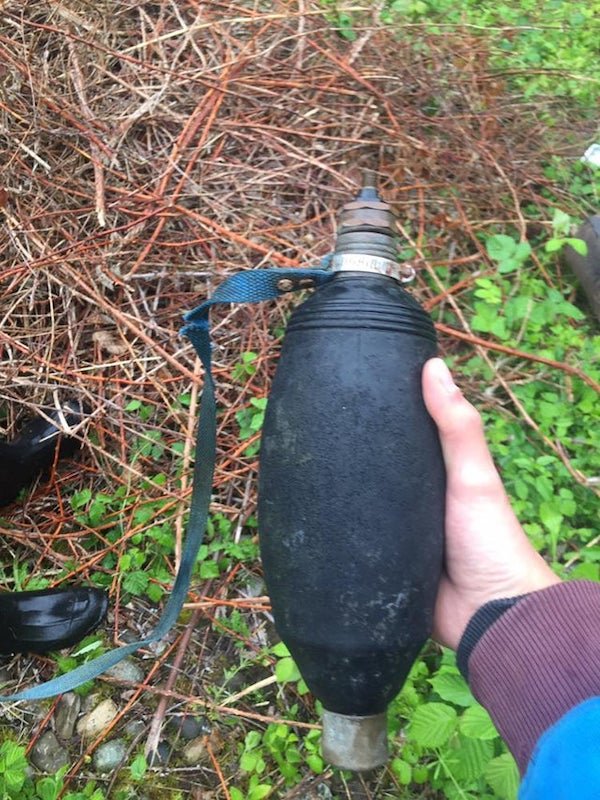 Found this thing in my back yard. the black stuff is rubber. there is a powerline going over my house maybe it has something to do with that?

A: Drain king. For clearing out pipe/drainage blockages. Looks like someone attached a Schrader valve to it.