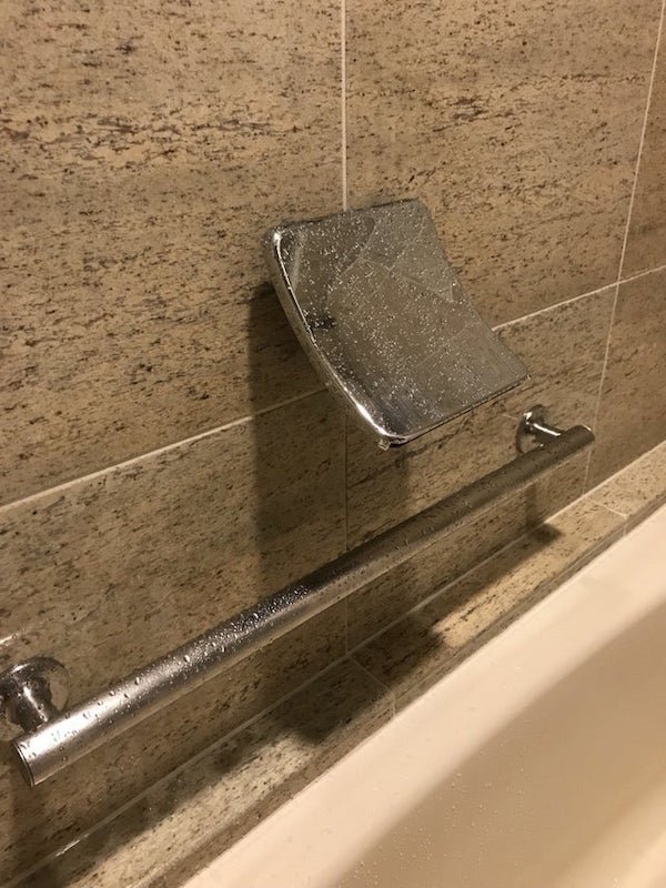 What is this curved metal fixture above hotel tub handle?

A: It’s a waterfall bath filler