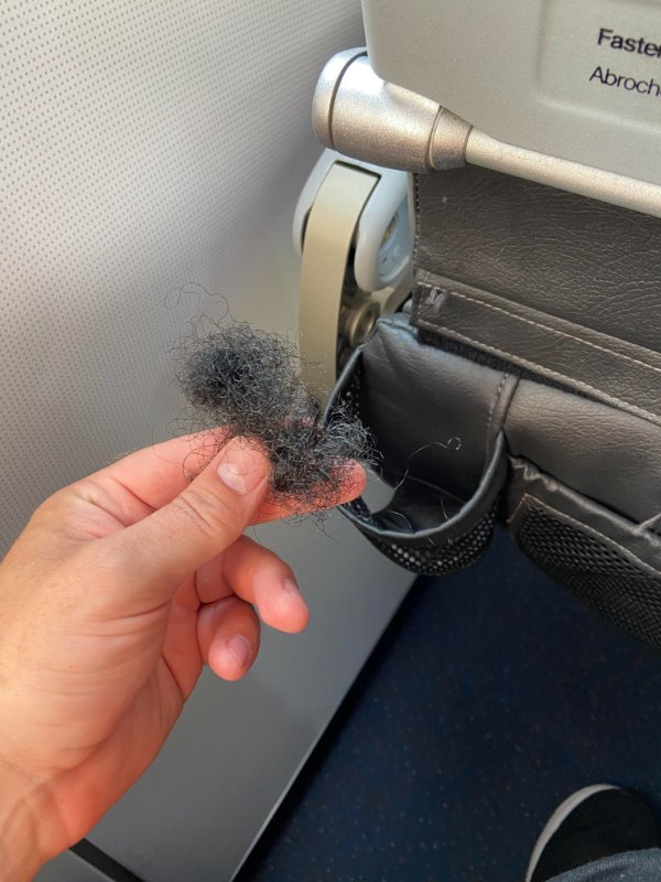 “We sterilize every flight” but apparently do not remove human hair from a cup holder do we JetBlue?”