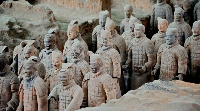 Researchers in China believe they’ve solved the 2,200-year-old mystery behind the polychrome paint of the famous Terra-Cotta Army.Discovered back in 1974, the Terra-Cotta Army is a vast collection of almost 9,000 statues representing soldiers, chariots, and horses buried with the first emperor of China, Qin Shi Huang, to serve as his imperial guard in the afterlife. When they were found, some of the sculptures still contained patches of colorful pigment and minute remnants of binding material, something exceedingly rare in statues buried underground in water-saturated sediment for over two millennia. The pigments have previously been identified—inorganic compounds such as cinnabar, azurite, and malachite—but the bonding agent and the precise method used to paint the Terra-Cotta Army remained elusive until now.To find their answer, Chinese scientists used a state-of-the-art technique called matrix-assisted laser desorption/ionization time-of-flight mass spectrometry (MALDI-TOF-MS).[4] The high levels of sensitivity provided accurate results despite trace amounts of bonding agent. The results were then compared to “artificially aged” samples of period-accurate adhesives through peptide mass fingerprinting, which identified the proteins in each specimen.According to the study, ancient Qin dynasty artists first coated the sculptures in one or two layers of lacquer obtained from a Toxicodendron tree, commonly known as the Chinese lacquer tree. Afterward, they either applied polychrome layers directly or, in most cases, used binding media made out of animal glue.