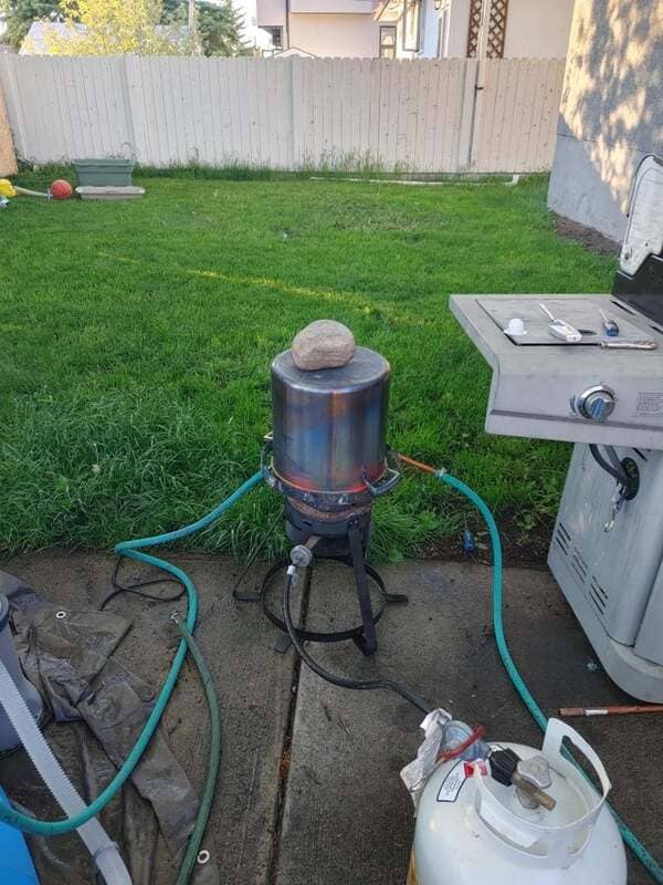 My pool was too cold and I had a turkey fryer burner, a pump and $50. This is what I came up with.