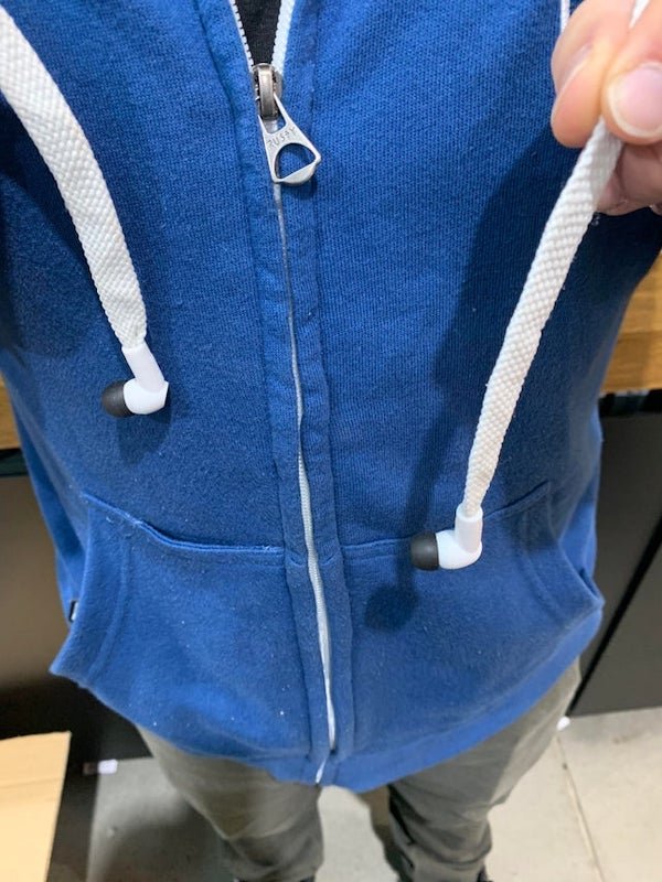 My co-worker’s hoodie has headphones threaded through the drawstring.