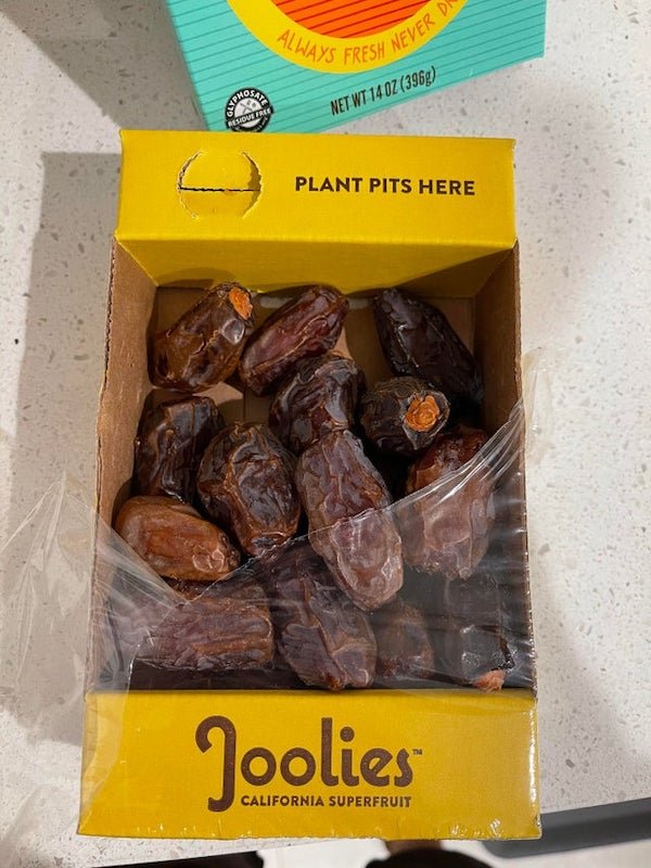 This box of dates comes with a built in area to throw away the pits.