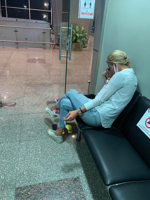 Taking your child to the airport smoking room.