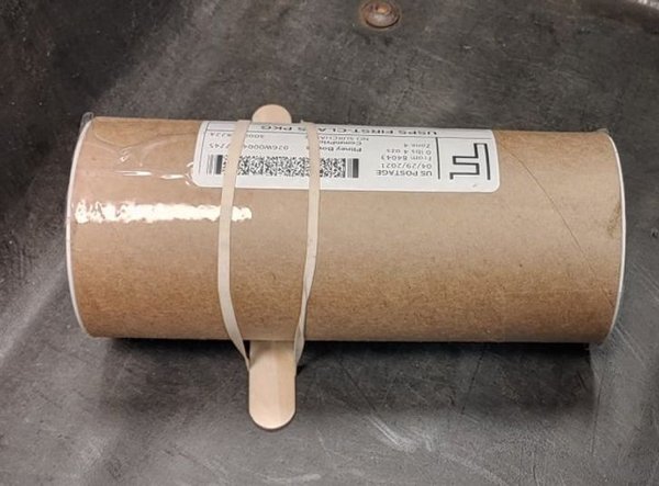 A customer mailed this tube with a tongue depressor attached to it so as to prevent it from rolling around.