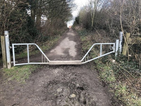 This gate allows access to horses but not vehicles.