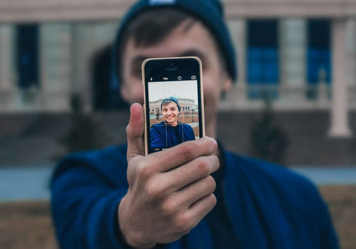 The background wallpaper on their phone. Especially when it's a picture of themselves. Who puts a photo of themselves as the background photo on their phone? Weird!