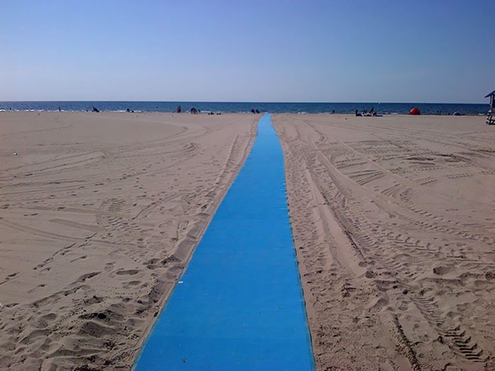 The Town Installed An Accessibility Matt On The Beach For Wheelchairs And Strollers