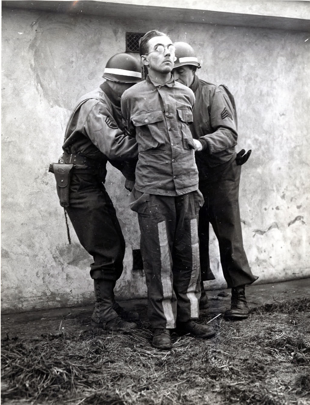 German spies being prepared for execution after being caught wearing allied uniforms behind enemy lines, Bastogne, Belgium, 1944