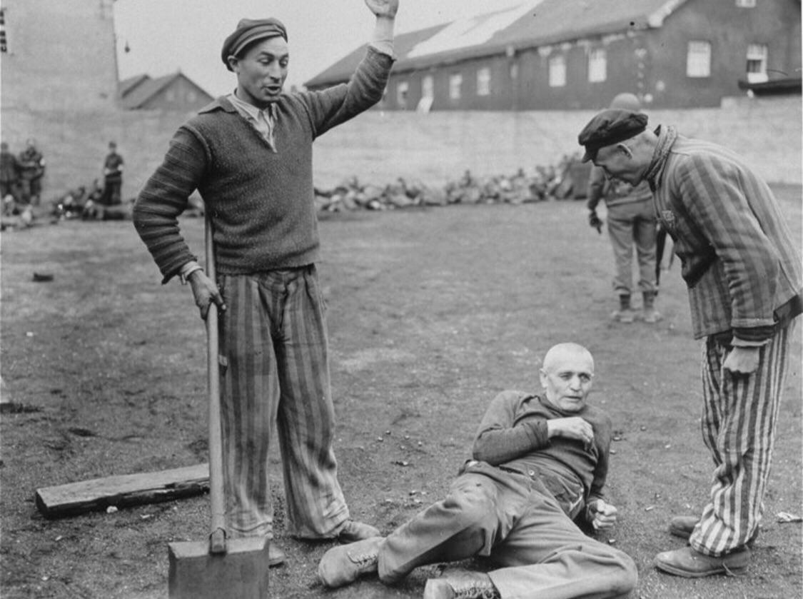 SS guard moments before he’s beaten to death by Jewish prisoners after the liberation of Dachau