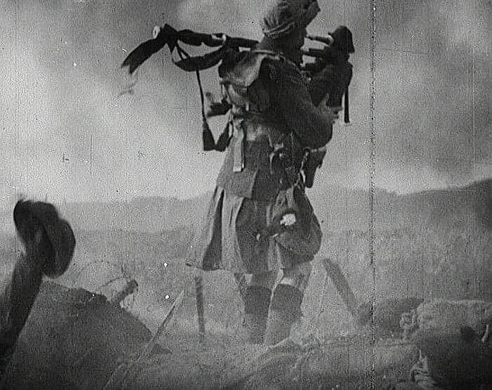 A Scottish piper wearing a kilt enters the battlefield during World War 1.⁣