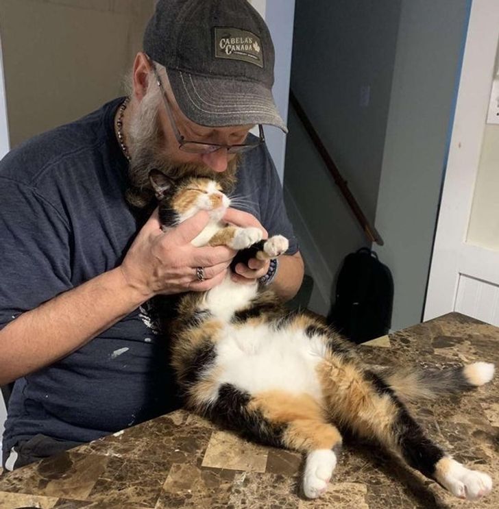 “My dad and the cat he ’didn’t’ want.”