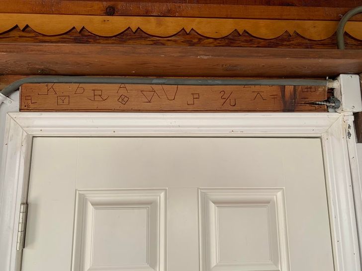 “Symbols carved over a door in our new house”