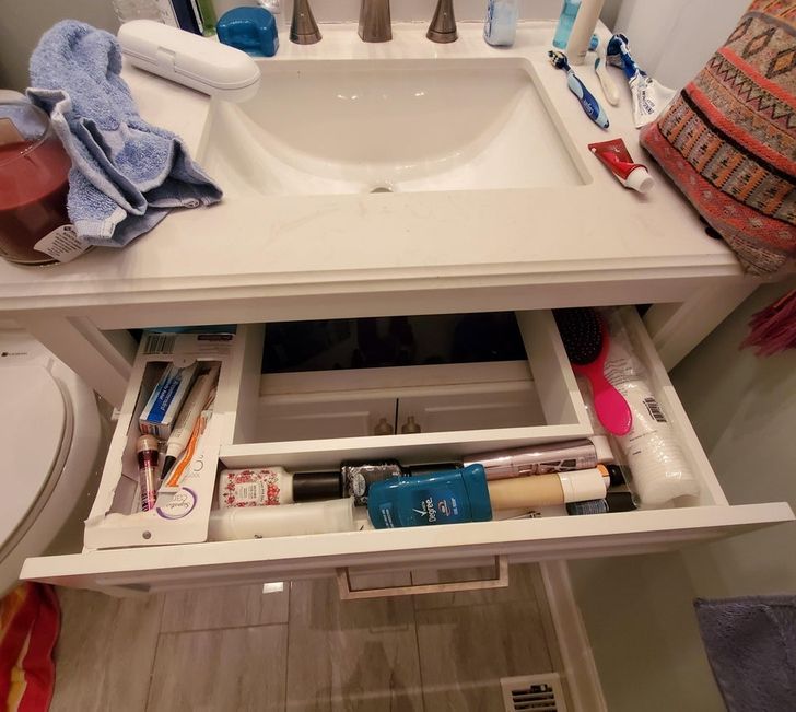 “New house has a drawer that goes around the sink.”