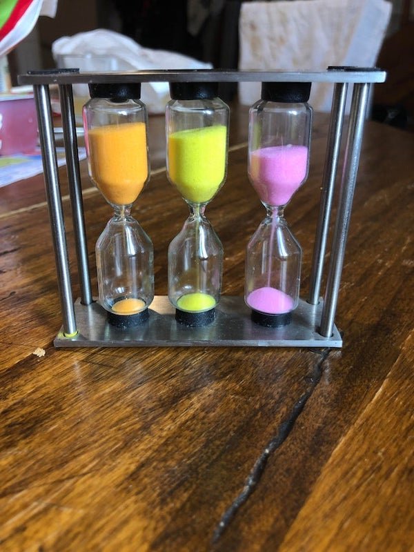 If you’re struggling with your kids under 10 Yo being to slow to dress, eat or anything and you’re always late, use a sand timer to give them a visual reference of the passing time. It also helps working on basic additions.