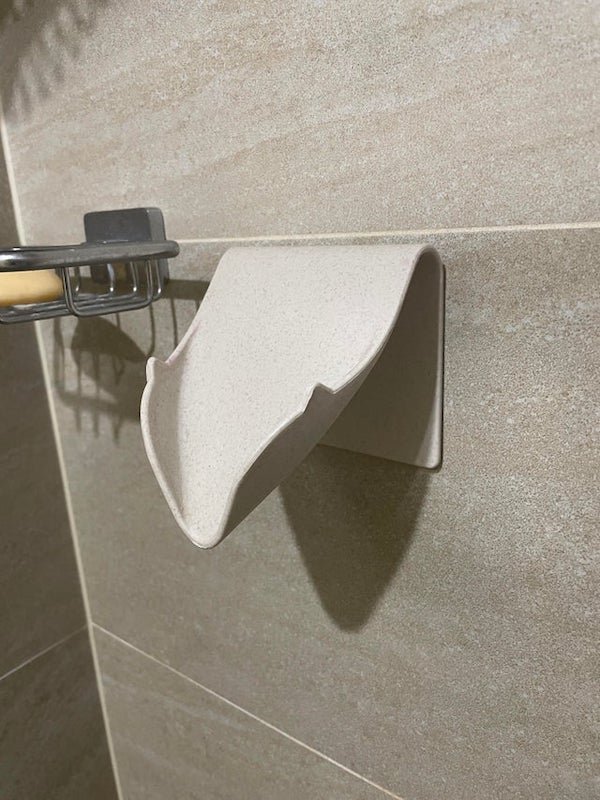 What is this attachment on the shower wall in our apartment? Looks too wide to hold soap I think.

A: Soap dish/sponge holder