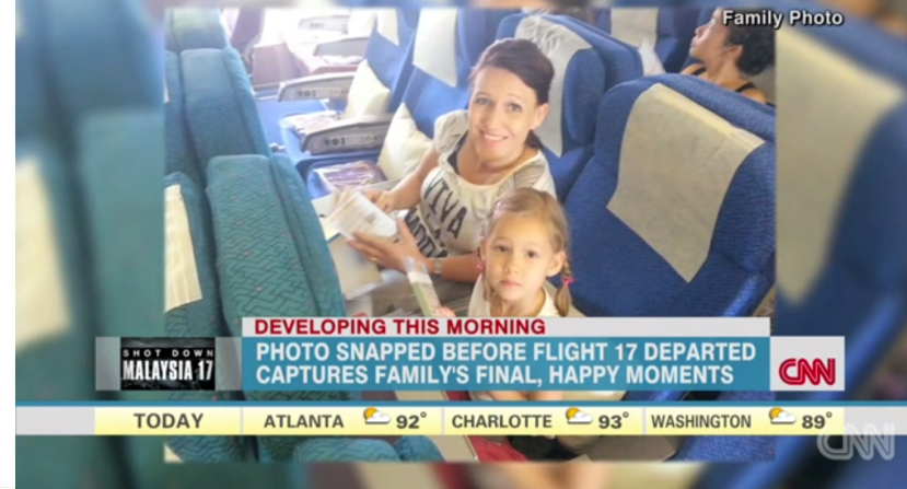 This is a photo of a kid and her mom onboard mh17 before takeoff. Everyone on the flight was killed that day