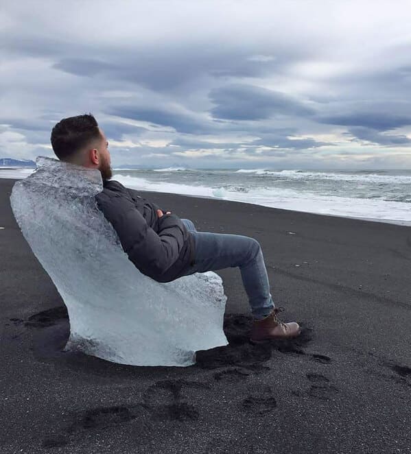 “A Sea Weathered Chunk Of Glacial Ice Made A Perfect Chair On A Black Sand Beach In Iceland”