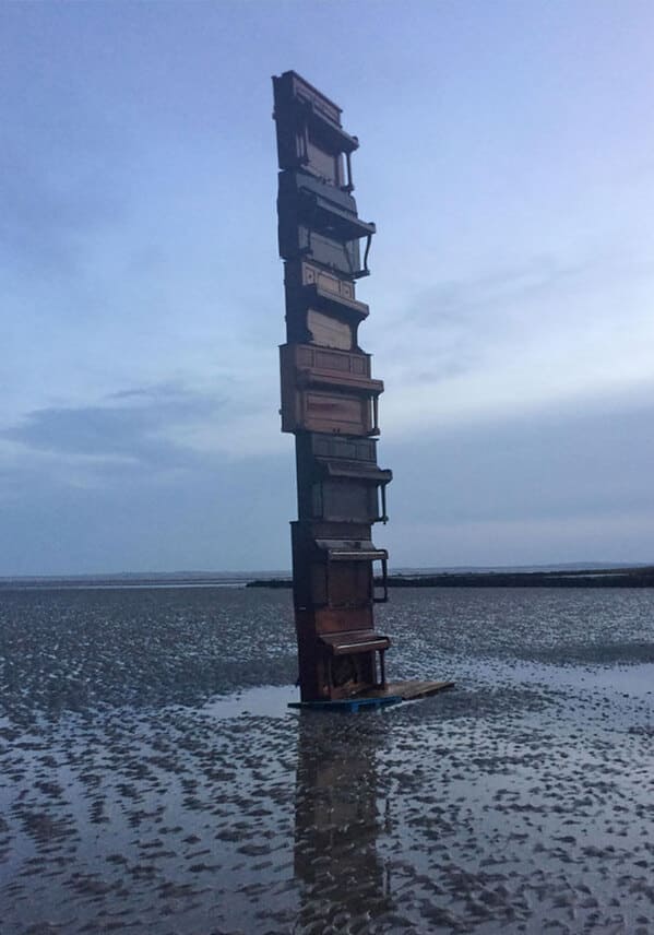 “This Stack Of Pianos On A Beach At Low Tide”