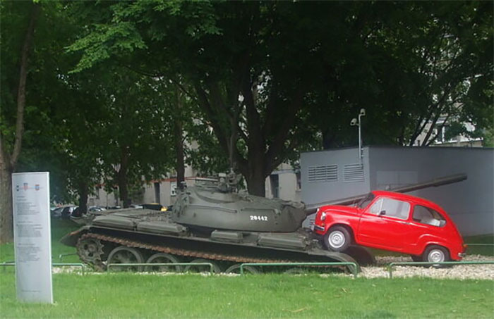 30 years ago a tank crushed a small red car in Osijek, Croatia, as a show of force. In 2011 a monument was built: a tiny red car, crushing a tank.