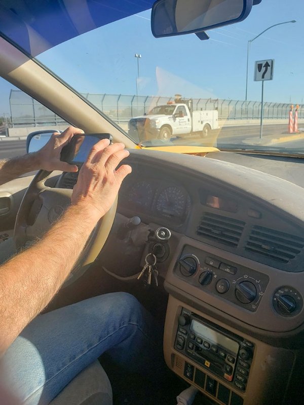 driving with phone on wheel