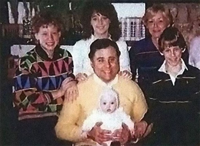 This is serial killer John Edward Robinson (yellow sweater) holding baby Tiffany Stasi, whose mother he murdered the day before.

He later gave baby Tiffany to his brother, saying she was adopted. His brother, along with Tiffany, didn’t find out the truth for 15 years.

Only eight of his victims have been identified, and he's been on death row since 2000.