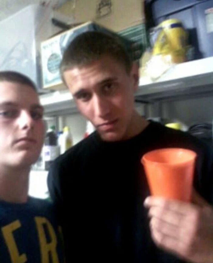 This is a photo of Tyler Hadley, the one holding a cup, at a party at his house.

Just before this party, he murdered his mother and father with a hammer and hid their bodies in the master bedroom.

During the party, Tyler showed his best friend, Michael Mandell, the room where he killed his parents, and he took this photo because he wasn't sure when he'd see Tyler again.