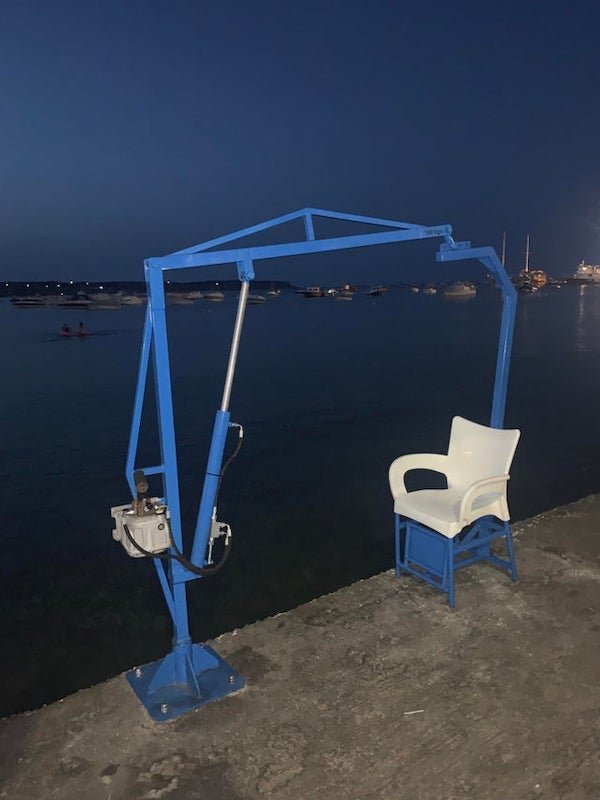 What is this seat used for? By the sea in Malta.

A: To get frail people into a boat. Usually found at swimming pools.