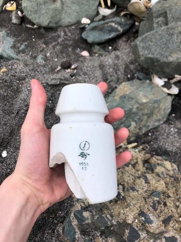Very heavy ceramic thing found on beach in Aomori prefecture, Japan. The inner and outer portion are all one piece. The innermost bit seems to be threaded.

A: It’s a ceramic insulator.