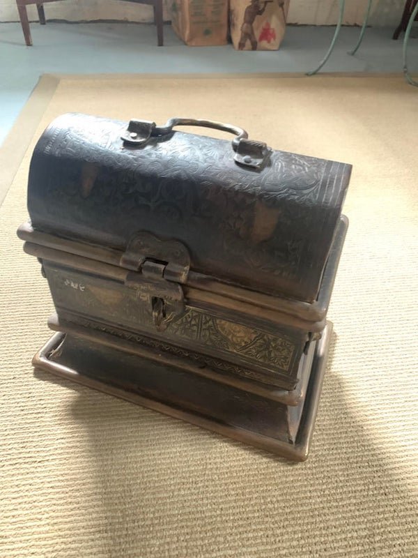 From India most likely, made of iron and opens like a treasure chest. 3 handles and a latch.

A: It’s a Paan Daan, a ceremonial box used to hold betel leaves and nuts. Apparently Betel leaves have a narcotic effect when chewed.