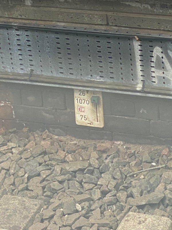 What is this sort of sliding meter sort of thing I always see located near train and tram tracks in the UK?

A: All signs are explained here.