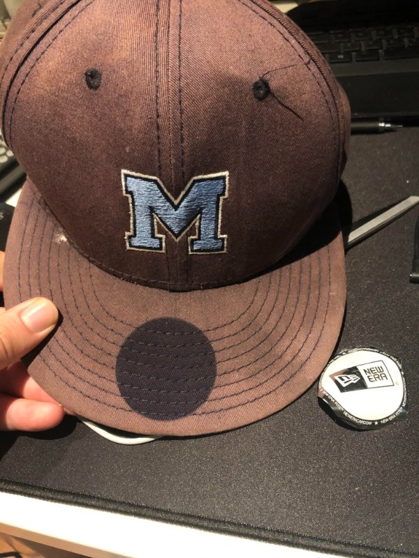 “The sticker on my high school hat I’ve had for 10 years fell off showing the original color.”