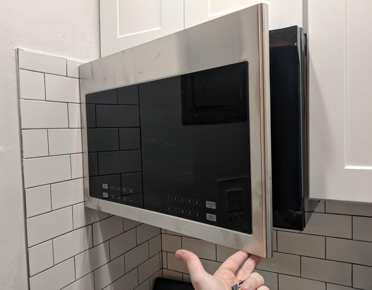 “Landlord hung the microwave, and this is as far as it opens before hitting the wall.”