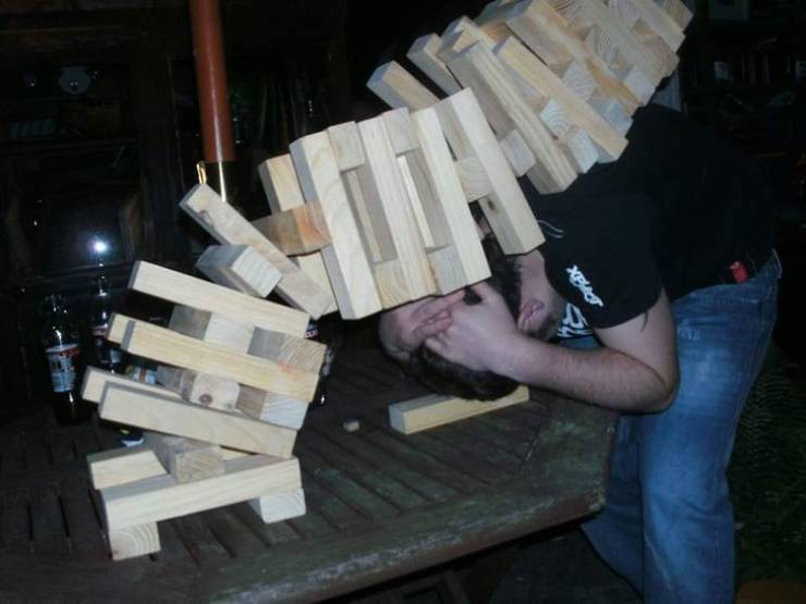 “My friend losing a game of giant Jenga”.