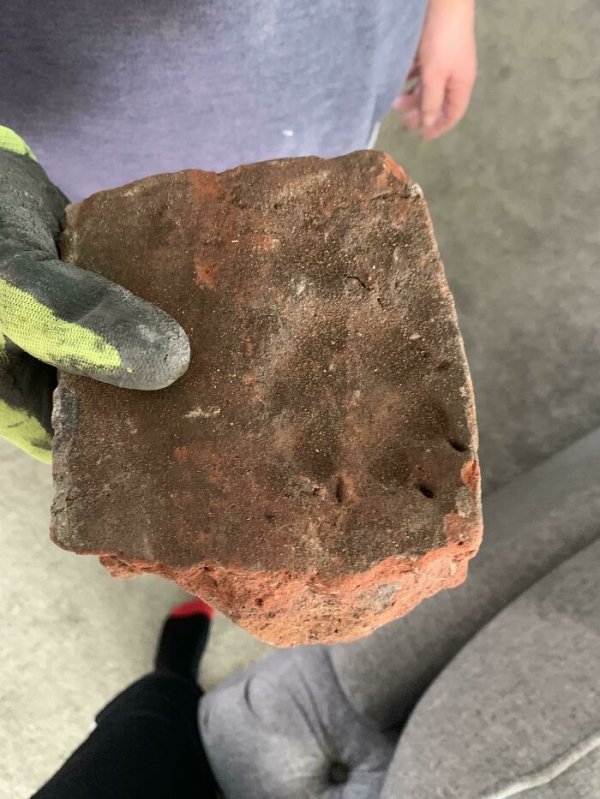 A 300-year-old brick with a paw print in it.