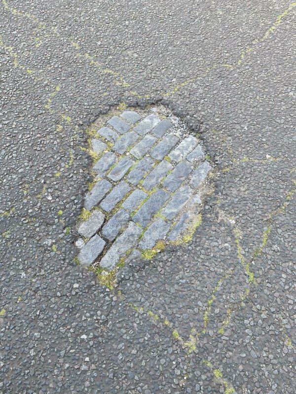 A road on my work commute in London is eroding and starting to expose the old cobblestone street.