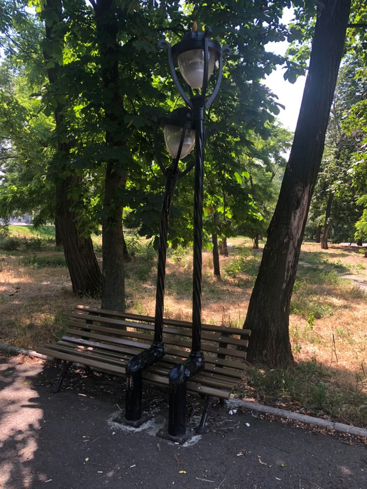 “These streetlights are stylized as a couple on the bench.”