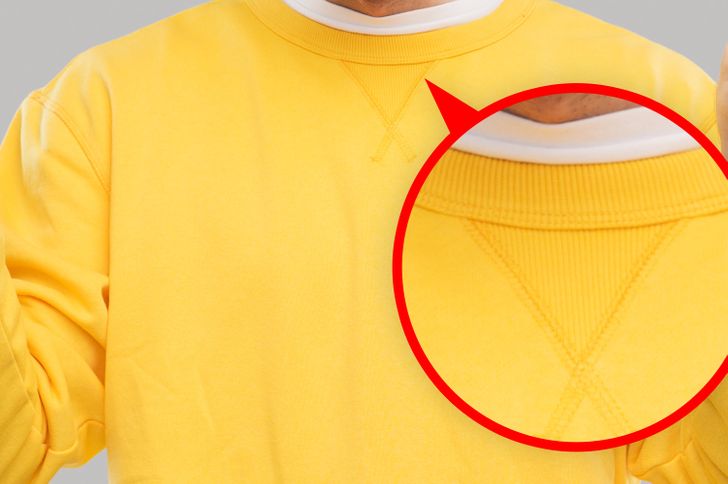 That V shape on your comfy sweatshirt. Initially, this V shape served 2 main purposes: first, it helped a sweatshirt maintain its shape throughout the years. It also helped the wearer fit their heads in the garment in case they needed to stretch it. Second, it absorbed the sweat that is mainly gathered around that area when a person is exercising. Currently, many companies have stopped using this small design, and those who still add it, use it mostly for decorative reasons.