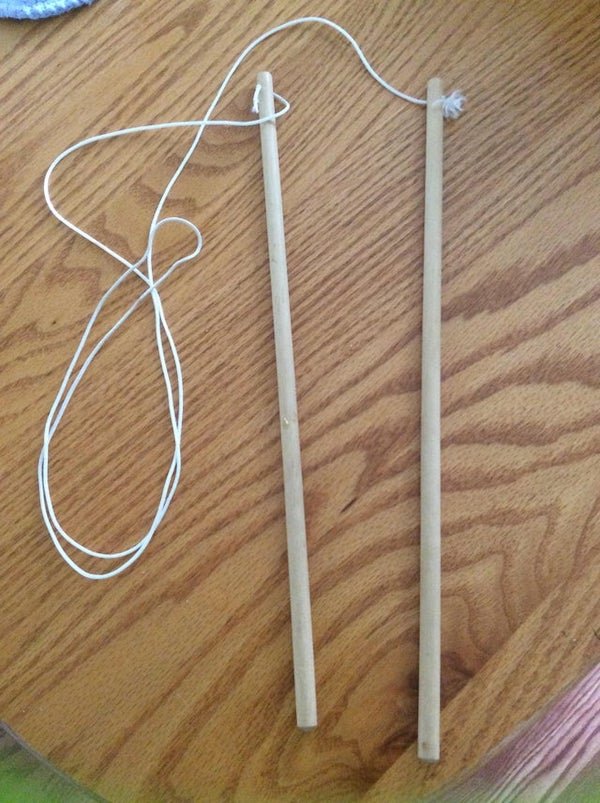 What is this thing with cord about 5 feet long and two handles(?) about 14 inches long?

A: That’s the string to a diabolo. It’s a sort of yo-yo that people juggle with.